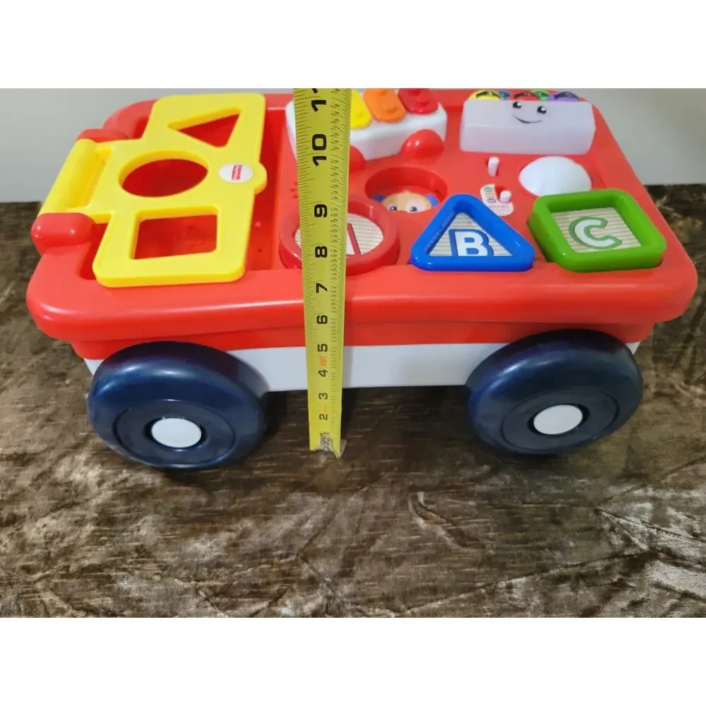 ​Fisher-Price Laugh & Learn Pull & Play Learning Wagon Musical Toddler Toy
